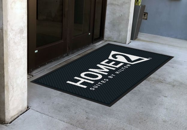 http://custom-mats.com/cdn/shop/products/hilton-home-outdoor-custom-logo-mat.jpg?v=1623373964