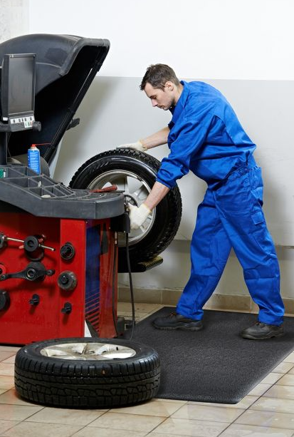 Mechanic standing on anti-fatigue mat