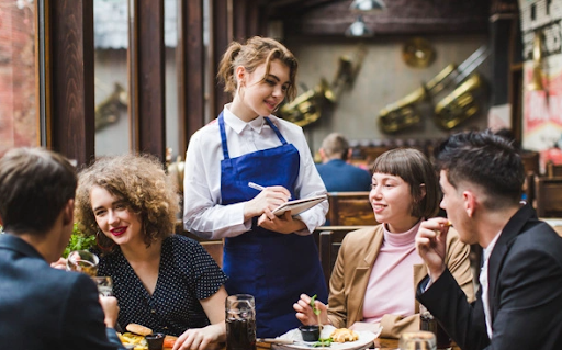 Waitress helping customers in restaurant