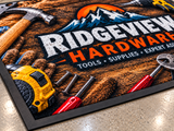 Close-up of Computer Dyed Photorealistic Logo Mat with Rubber Backing surface texture and logo detail