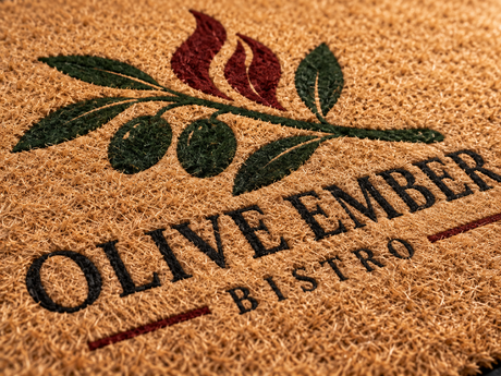 Close-up of Designer Coir Custom Logo Mat surface texture and logo detail
