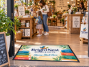 Custom POP logo mat displayed in a retail environment