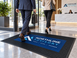 Rubber Scraper Custom Logo Mat shown in a commercial setting